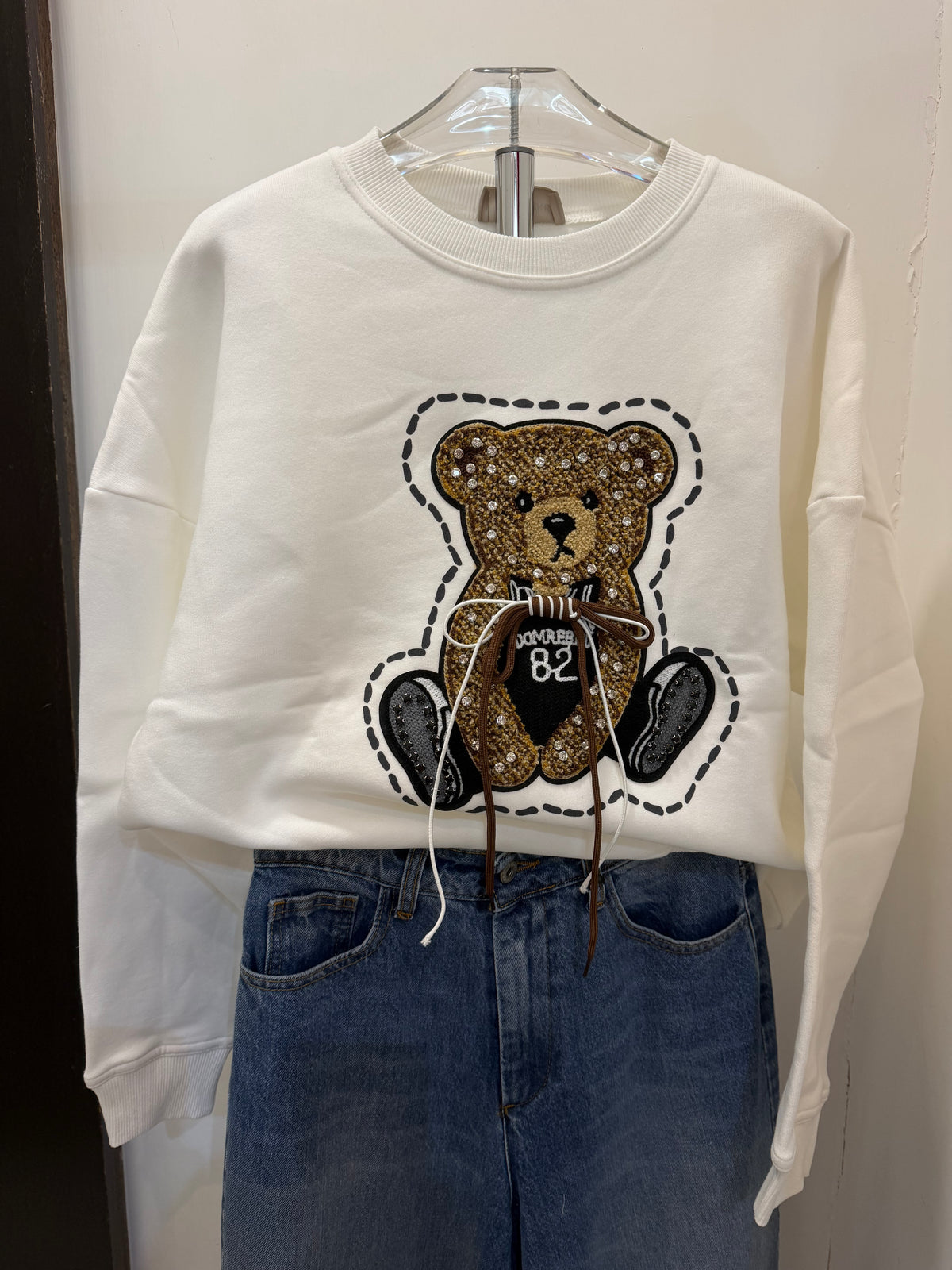 Felpa con teddy con applicazioni Emisphere