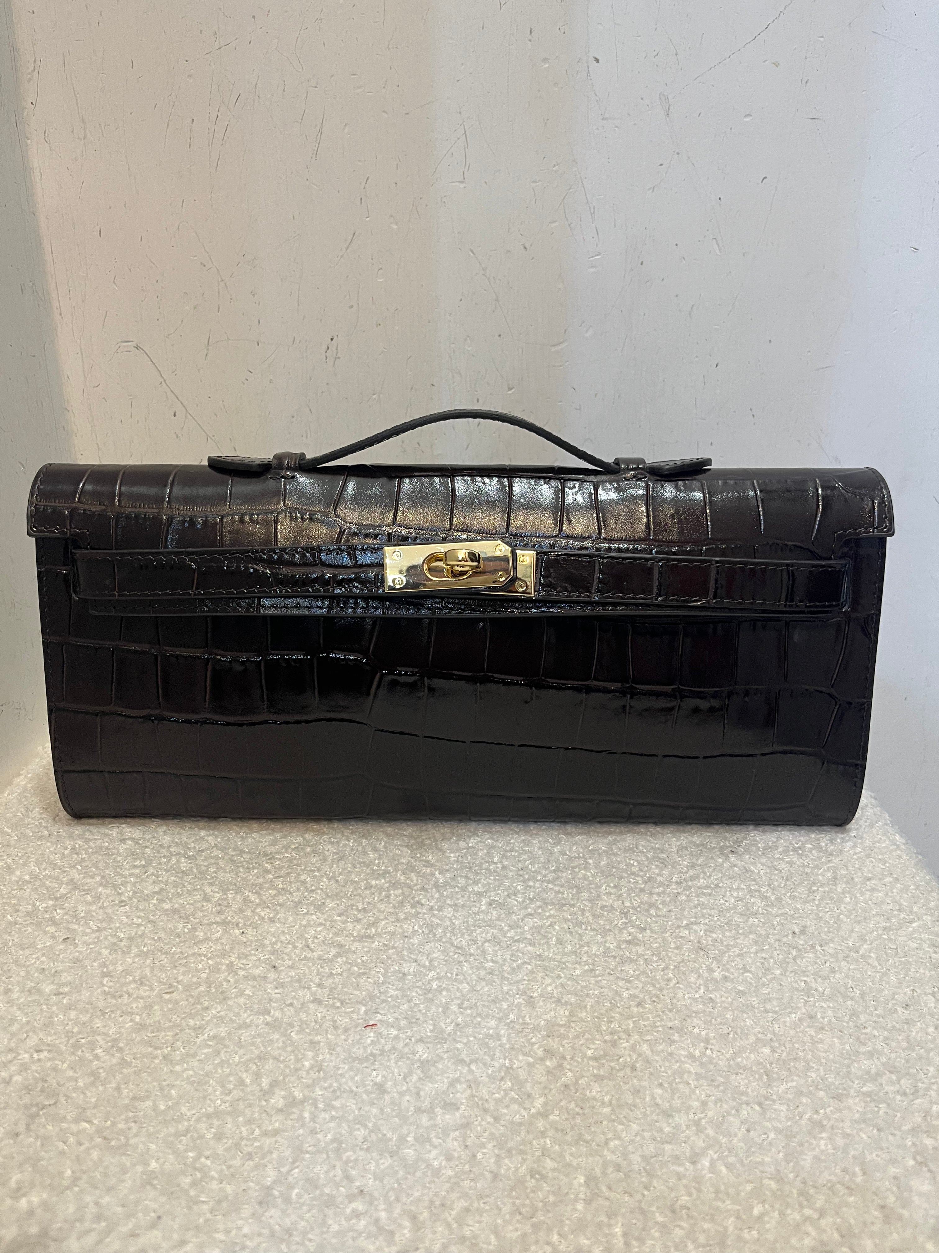 Pochette coccodrillo bustina con tracolla in pelle